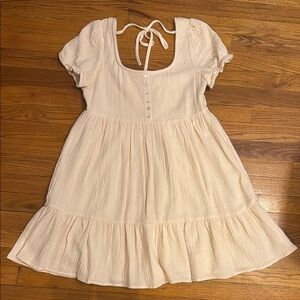 Linen tiered mini dress with puffed sleeves and back tie.
